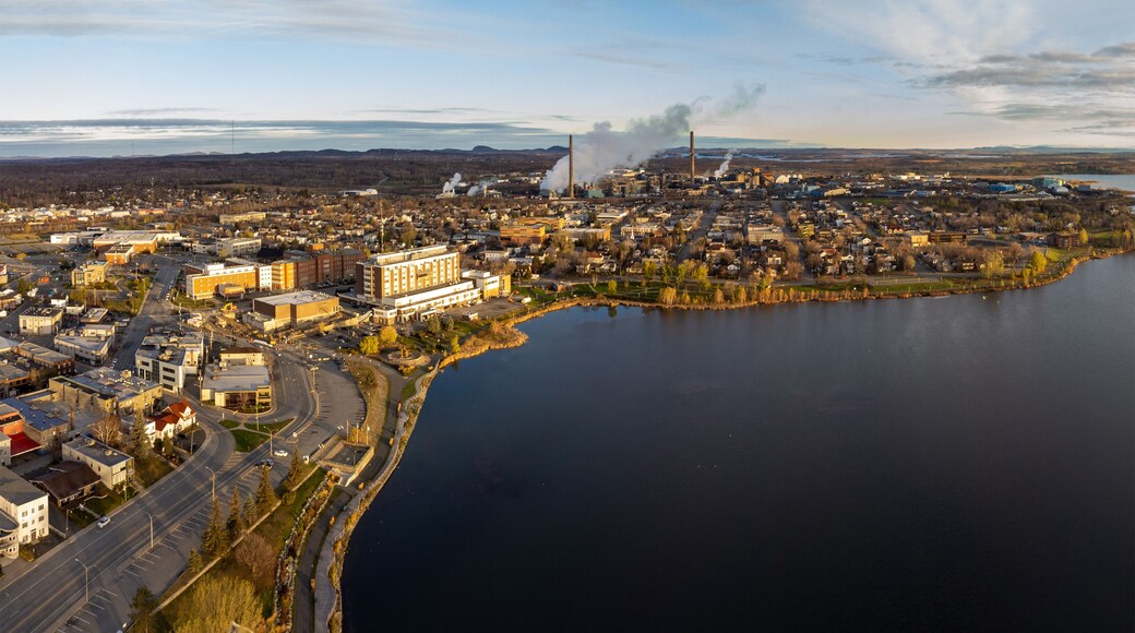 Aerial panoramic view of Rouyn-Noranda City and Osisko Lake on sunset time. Abitibi-Temiscamingue, Quebec, Canada.