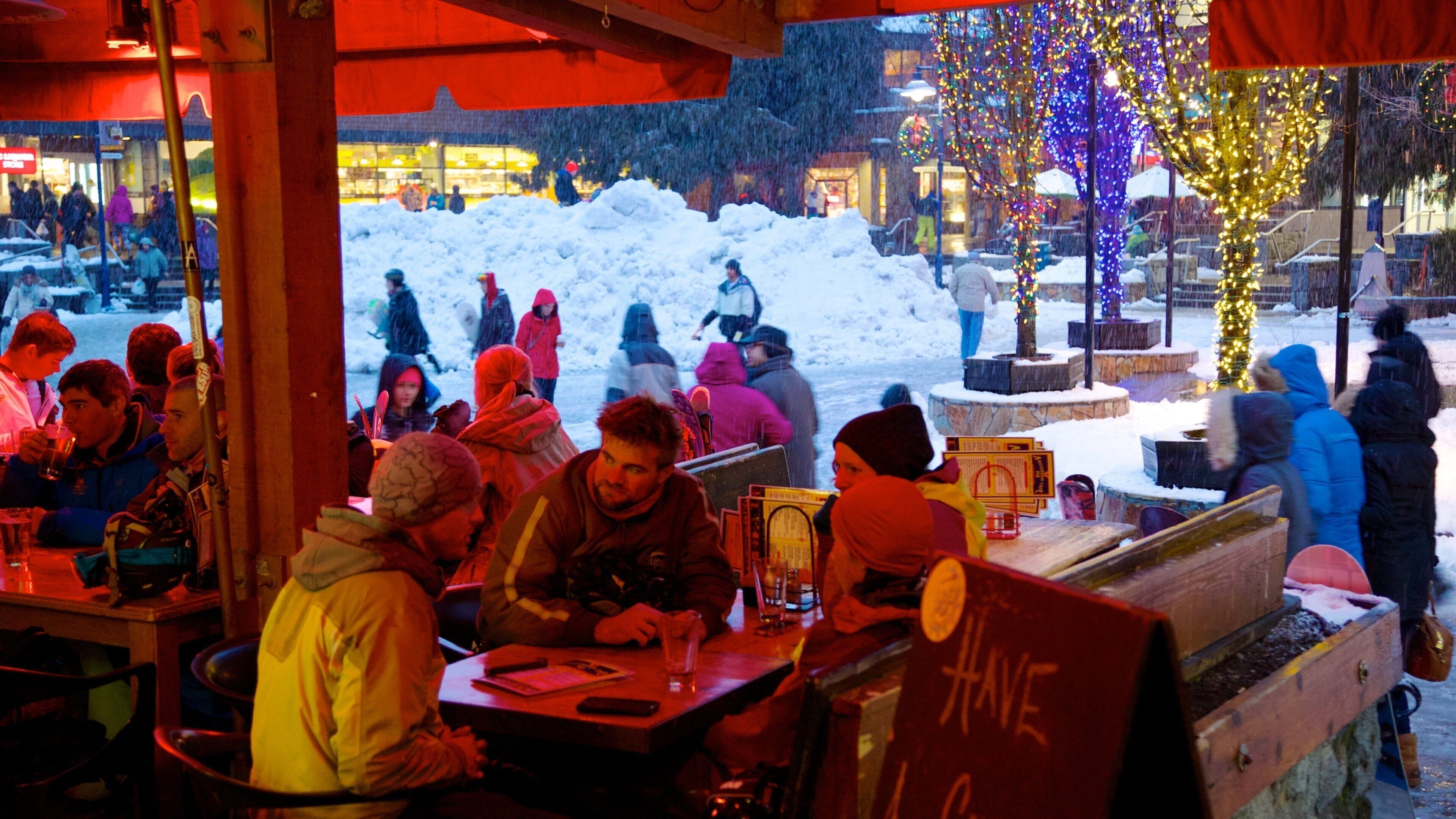 Whistler featuring outdoor eating and snow as well as a small group of people