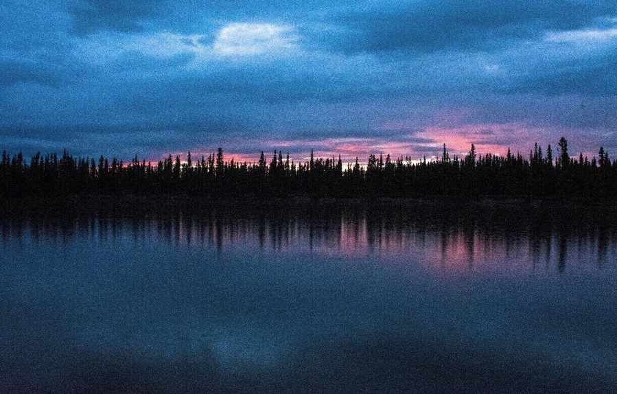 Sunset while camping along the Yukon River outside Whitehorse, Yukon, Canada.