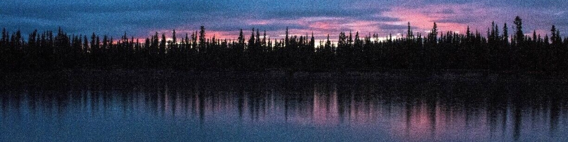 Sunset while camping along the Yukon River outside Whitehorse, Yukon, Canada.