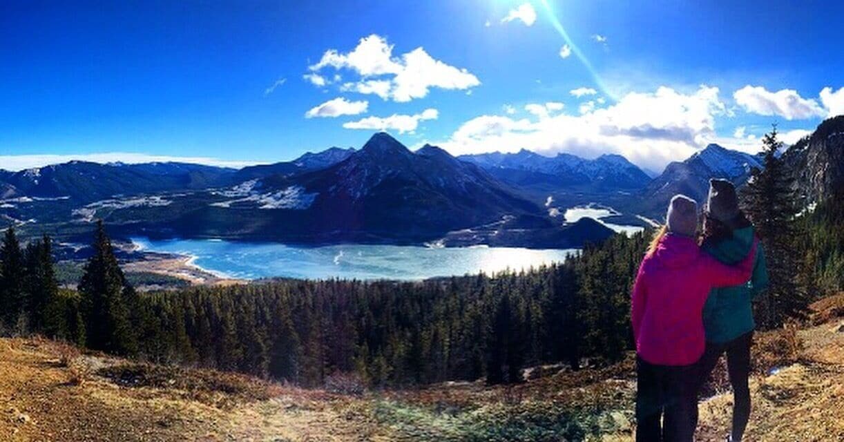 Friends who hike together, stay together! Enjoying the view of Barrier Lake while hiking in Kananaskis, Alberta.  