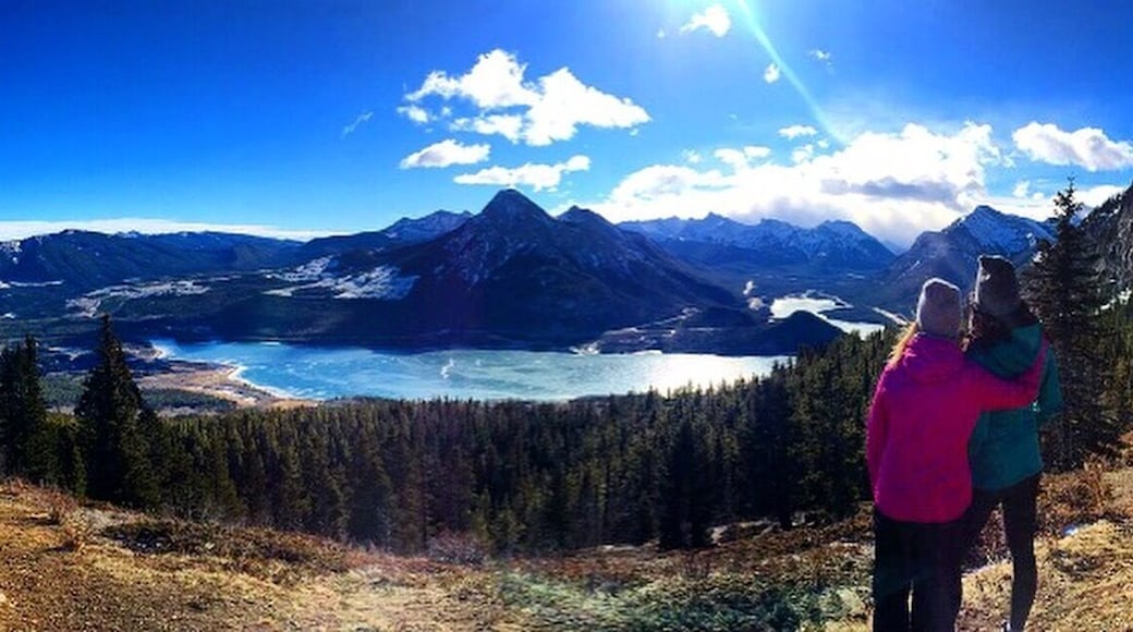 Friends who hike together, stay together! Enjoying the view of Barrier Lake while hiking in Kananaskis, Alberta.