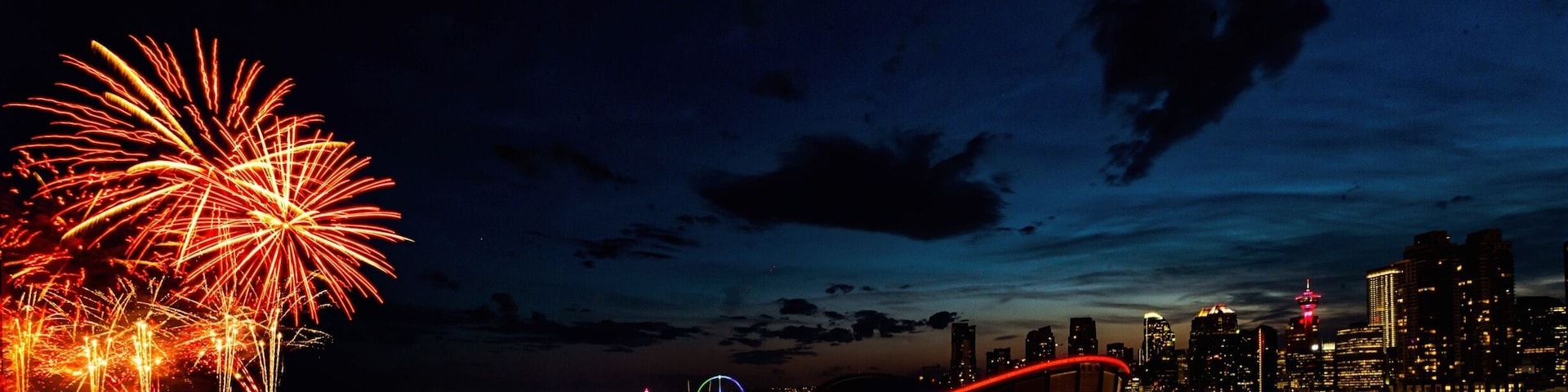 Calgary skyline with a sprinkle of stamped fireworks.