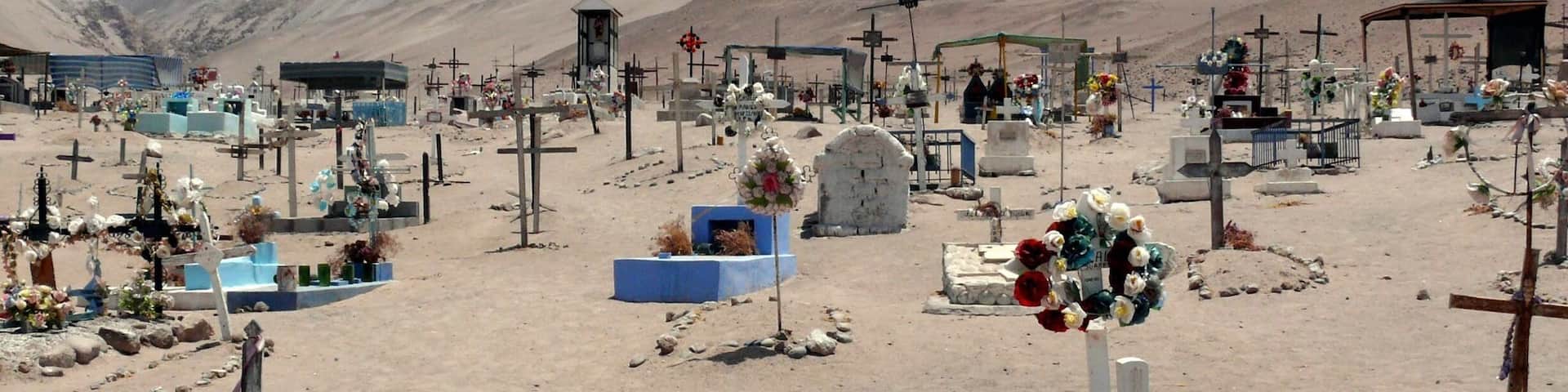 From the port city of #Arica traveling to the #Luca NP you pass the town on #Poconchille. Town makes it seem big. But it's not. What's cool about it is this not so little desert cemetery. Fun to walk along the graves. An unexpected sight.