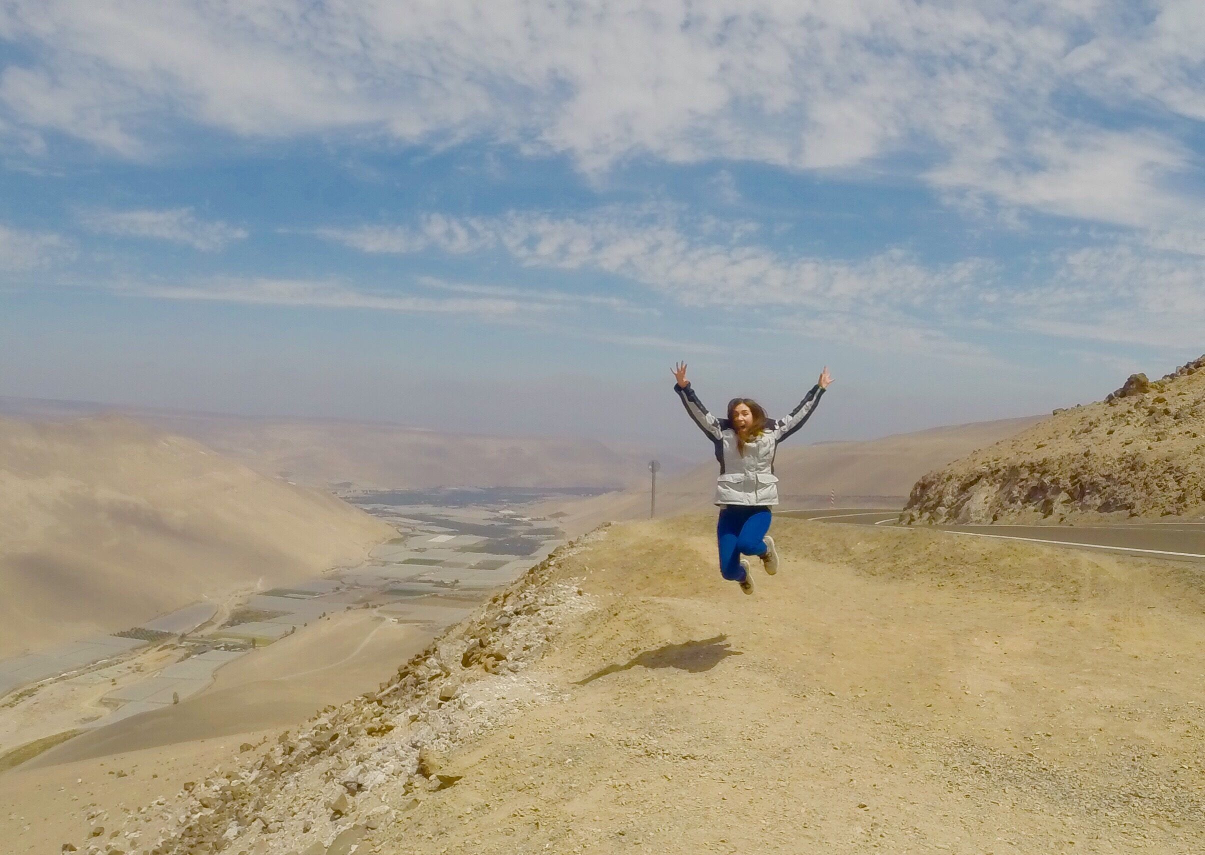 Jumping , with Azapa valley behind 