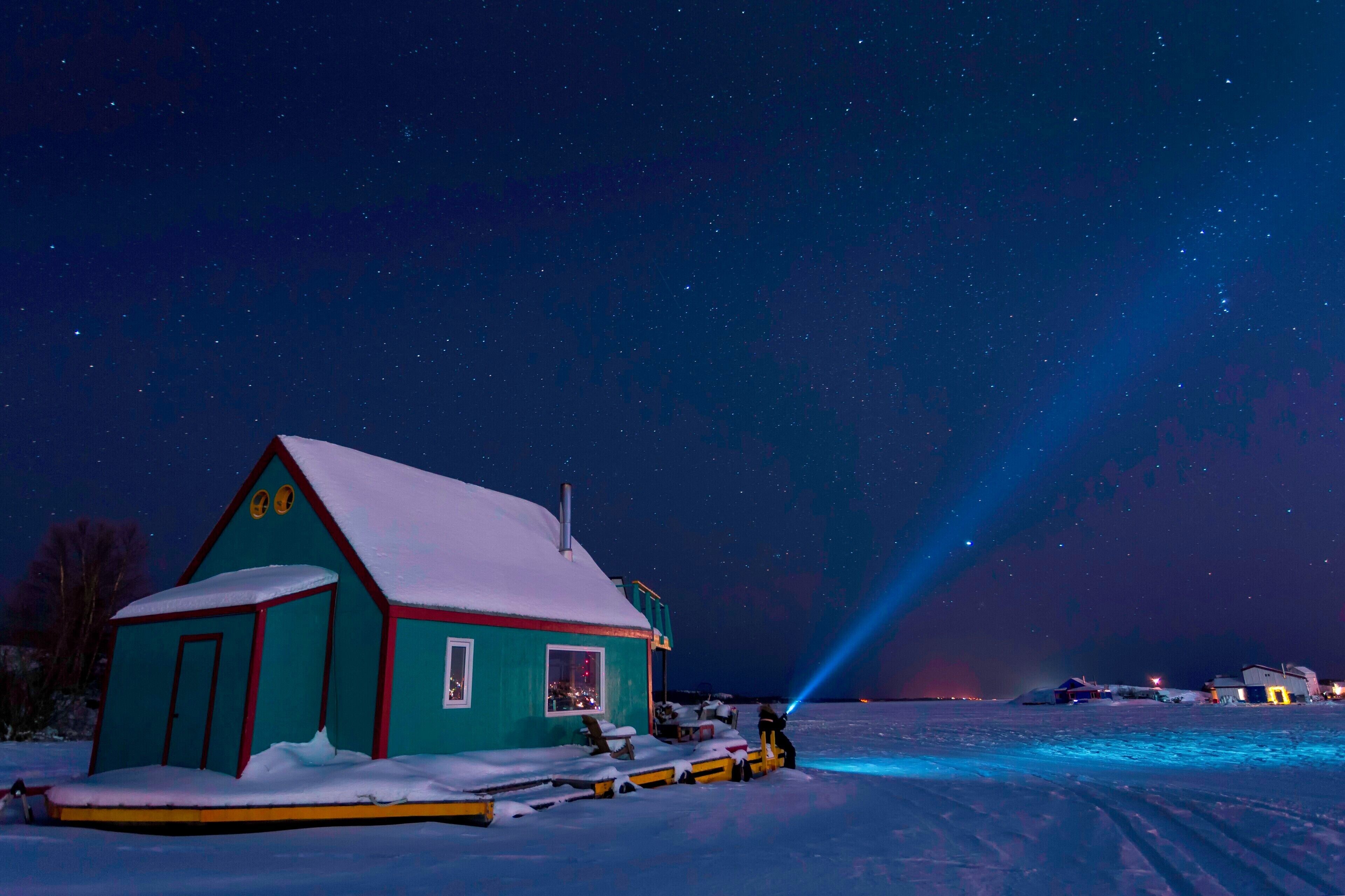 Frozen in time, Yellowknife floating homes scattered throughout the lake. Starry nights and cold clean air make for great night photography.