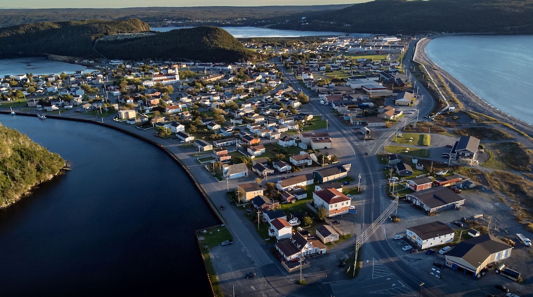 Aerial sand spit town of Placentia Newfoundland overlooking the East coast of canada and waterfront homes with beaches.