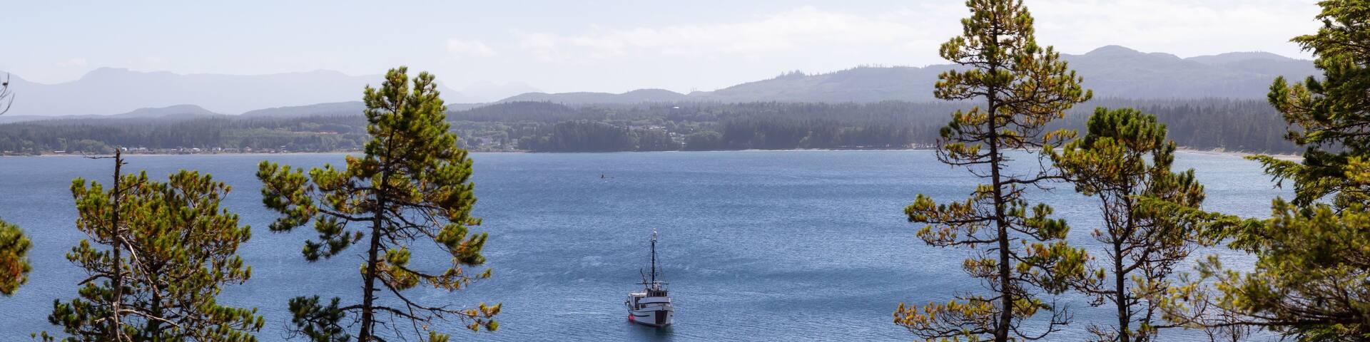 Fishing Boat parked in the ocean during a vibrant sunny summer day. Taken in Port Hardy, Northern Vancouver Island, BC, Canada.