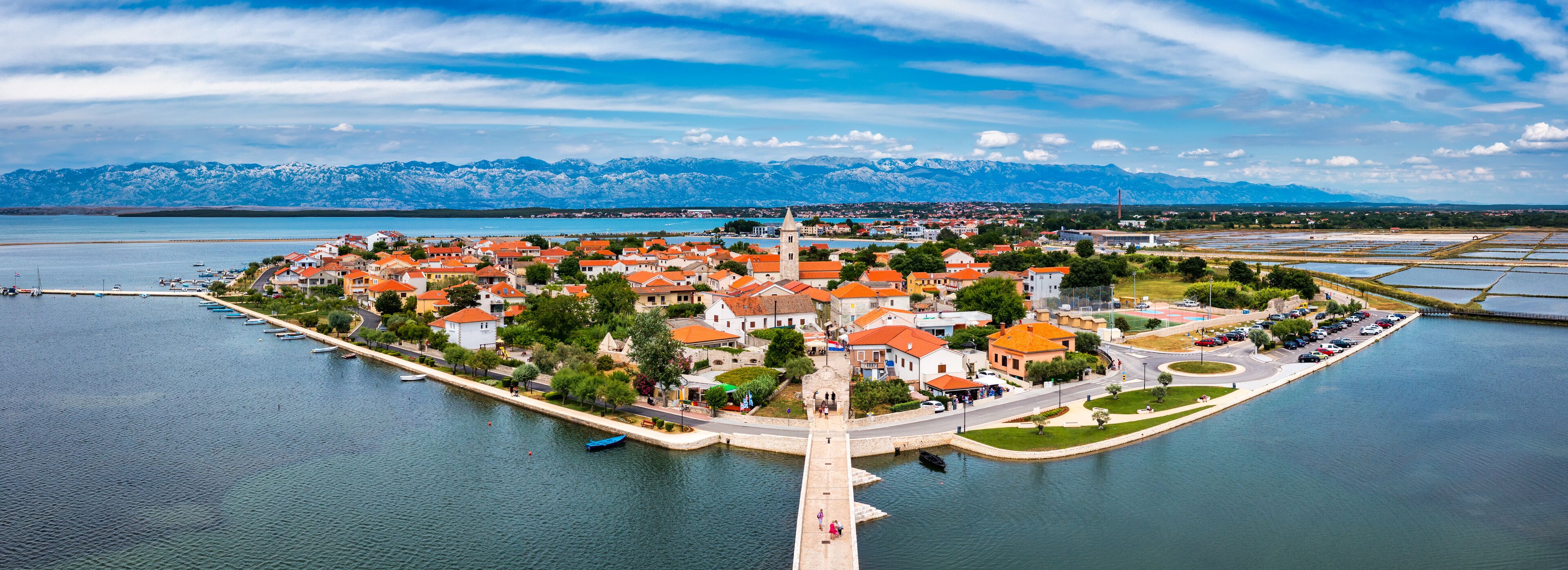 Historic town of Nin laguna aerial view with Velebit mountain background, Dalmatia region of Croatia. Aerial view of the famous Nin lagoon and medieval in Croatia