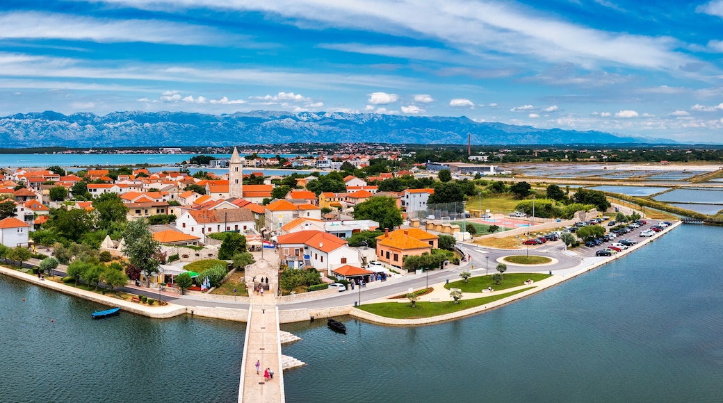 Historic town of Nin laguna aerial view with Velebit mountain background, Dalmatia region of Croatia. Aerial view of the famous Nin lagoon and medieval in Croatia