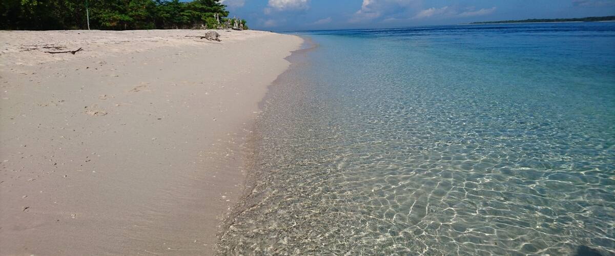 The famous pink beach. Oh well, slightly pink beach. Pink hue is a result of the crushed red organ pipe coral that was washed ashore.