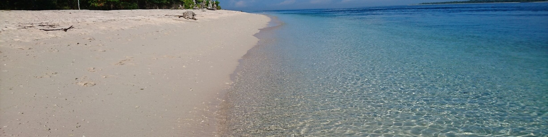 The famous pink beach. Oh well, slightly pink beach. Pink hue is a result of the crushed red organ pipe coral that was washed ashore.