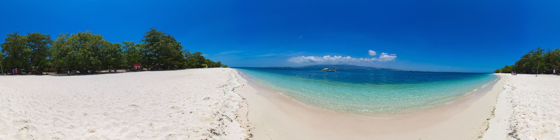 Tropical landscape: small island with beautiful beach, palm trees by turquoise water view from above. Great Santa Cruz island. Zamboanga, Mindanao, Philippines.