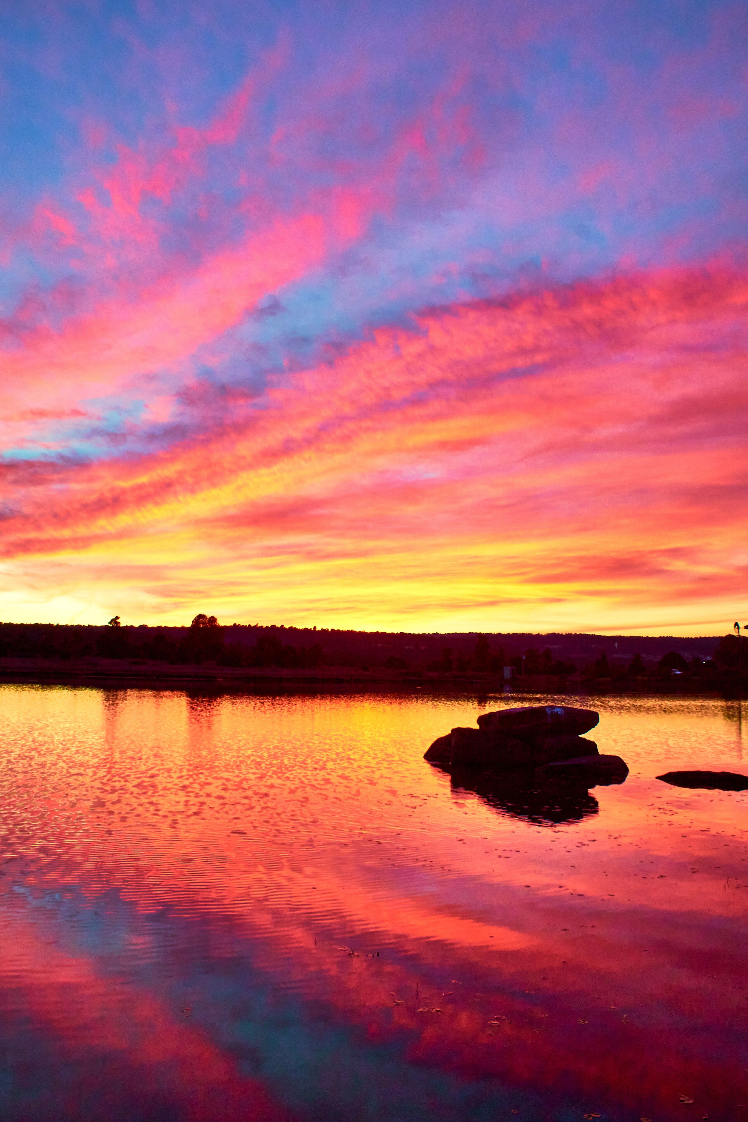 lake at sunset with red colors and amazing reflection on the water, gamboas lagoon in monte escobedo zacatecas 