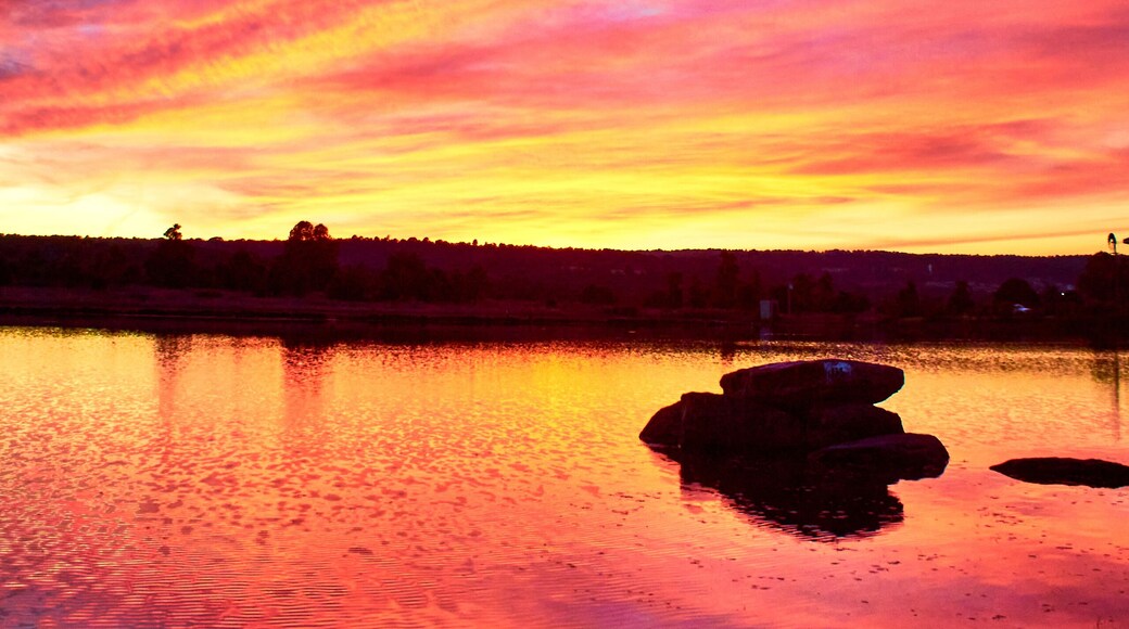 lake at sunset with red colors and amazing reflection on the water, gamboas lagoon in monte escobedo zacatecas
