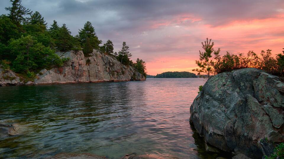 USA, New York State. Sunrise on the St. Lawrence River, Thousand Islands.