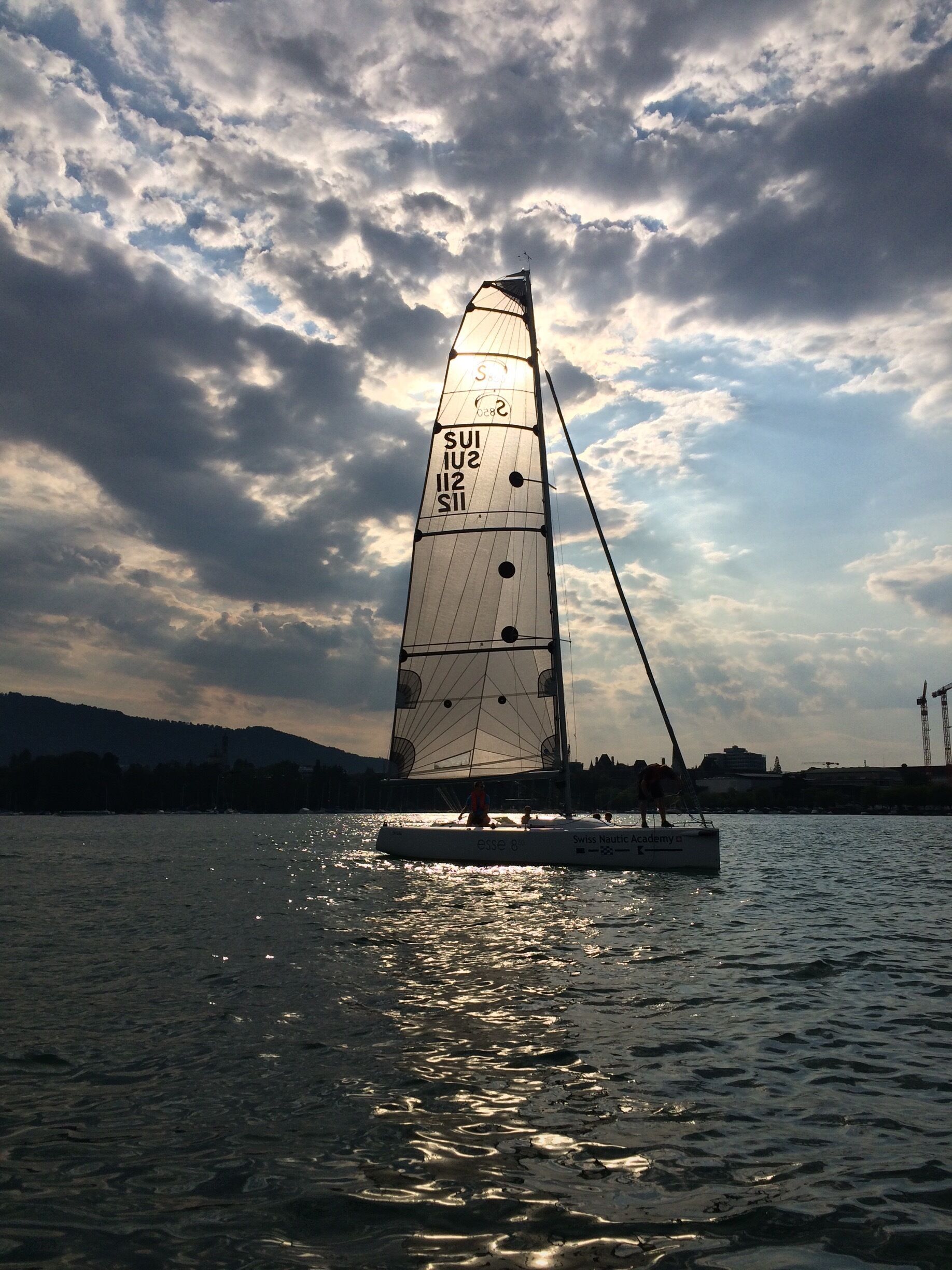 Boating at Lake Zürich during the sunset and witnessed this shadow game. 