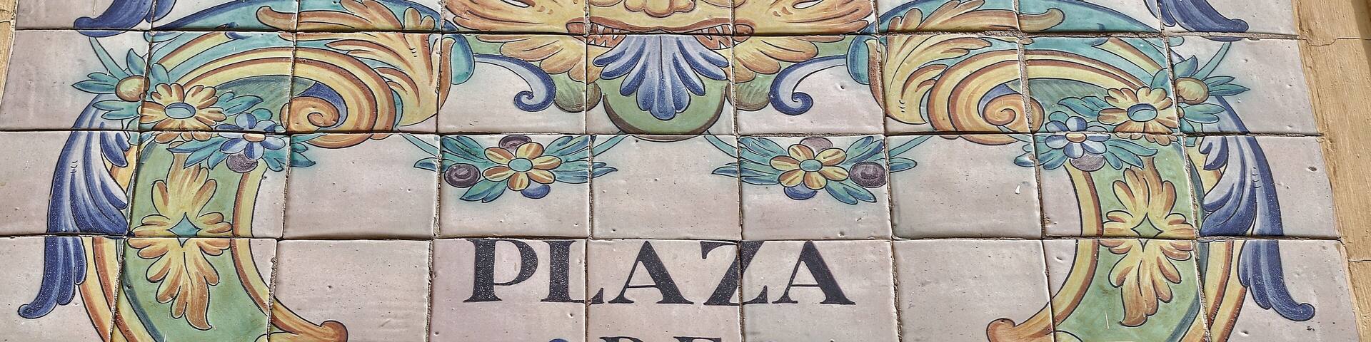 Ceramic tiles street sign of the Manises square in Valencia, Spain