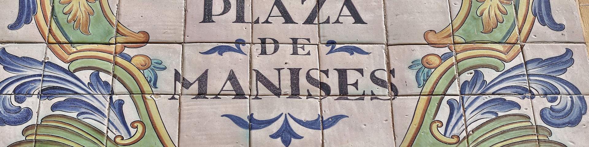 Ceramic tiles street sign of the Manises square in Valencia, Spain