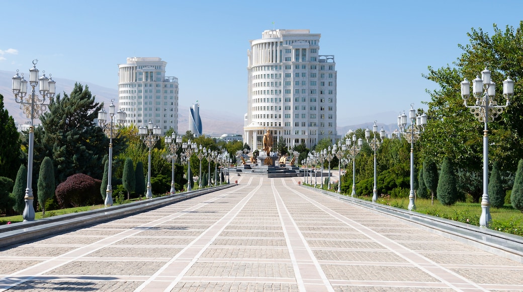 Ashgabat Independence Park in Turkmenistan. White marble buildings behind.