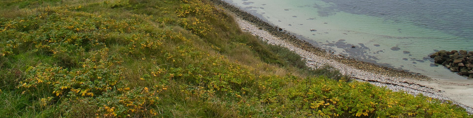 Hundested, Denmark on the cliff overlooking the sea. Baltic Sea coast, grassy