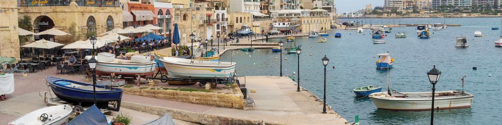 The beautiful bay is part of St Julian's, Malta.Now known for its many restaurants and hotels.