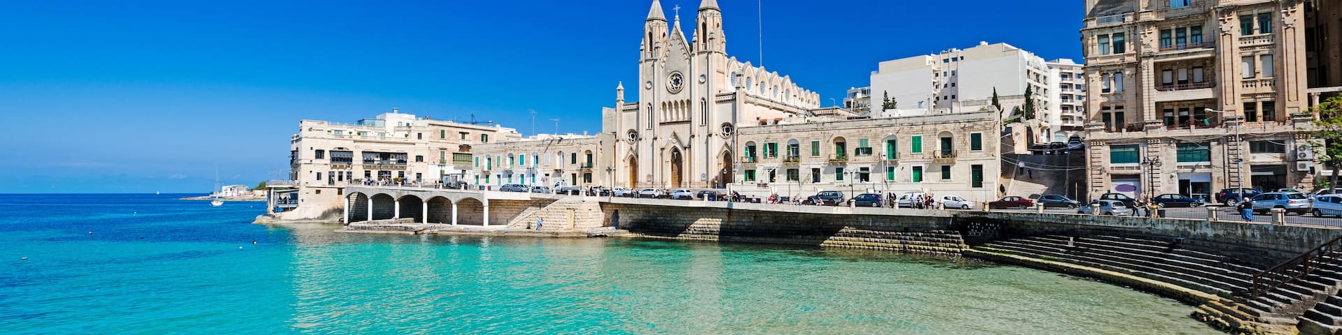 ST JULIANS, MALTA - APRIL 13, 2014: Our Lady of Mount Carmel Church on Balluta Bay in St. Julian's, Malta on April 13, 2014., Shutterstock ID 413998180, SF SSA Case with Manager Approval: Case 0715137