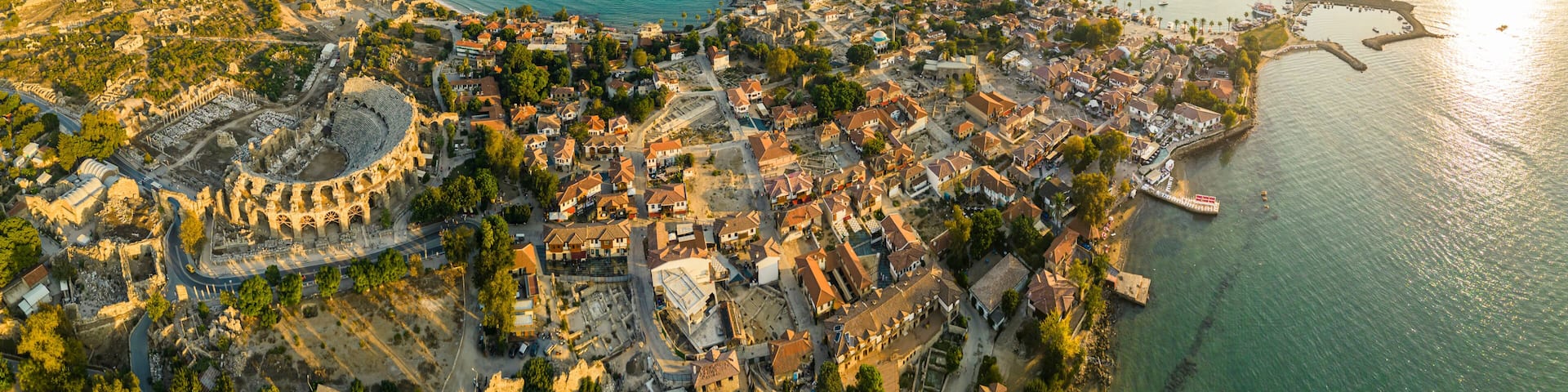 Aerial panoramic cityscape of Side, a resort town, in Antalya Province, Turkey, surrounded by the Mediterranean Sea, during the sunset,. High quality photo
