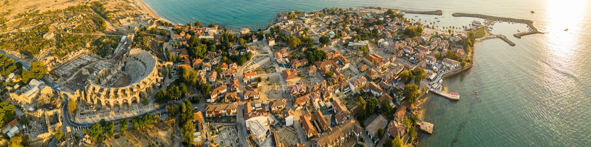 Aerial panoramic cityscape of Side, a resort town, in Antalya Province, Turkey, surrounded by the Mediterranean Sea, during the sunset,. High quality photo