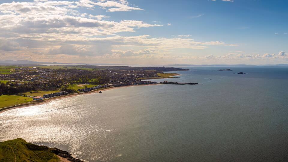 Aerial view of serene coastal town with North Berwick Law, North Berwick, Scotland.
