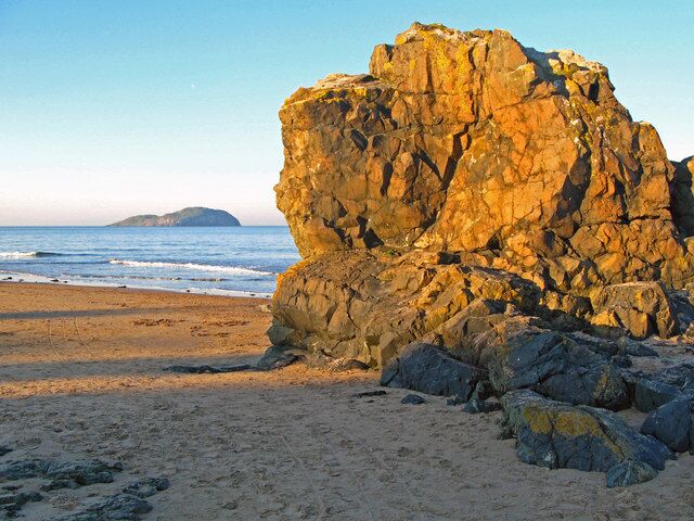 Leckenbane, rock outcrop at Milsey Bay At low tide a favourite clambering site for children and dogs. The island in the picture is Craigleith. Many volunteers have spent time on the island clearing mallow which is causing a reduction in puffin numbers by blocking nesting sites.