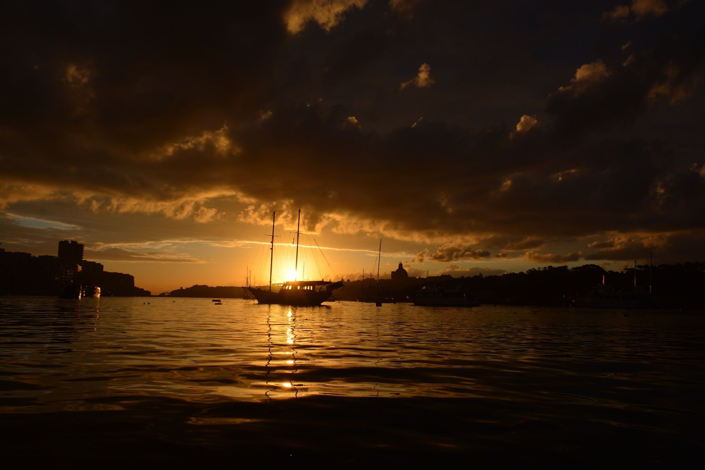 MALTA 
 “#goldenhour” “#waterlust”
 Just at the right place at the right time ....the last day of Malta trip in January ... I woke up very early by force, because the bus to the airport .... Then this magical surprise at the bus stop. Just turned around and ...wow!  I was absolutely delighted .... and not prepared, because I did not expect that! I just started shooting ... This photos have something magical for me I really do not want to touch the pictures from the sunrise by any post edition ,because I really like them for what they are .... Pure, original .... magical ...