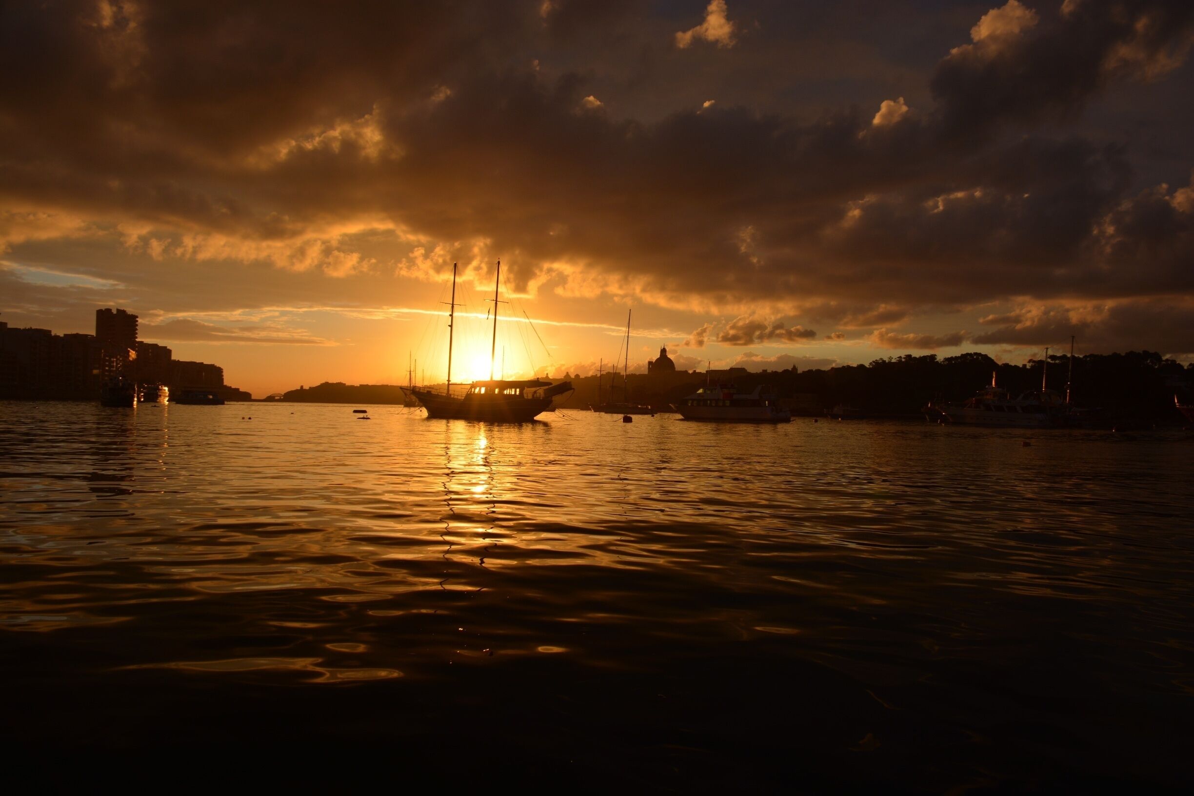 MALTA
  “#goldenhour”“#waterlust”
  Just at the right place at the right time ....the last day of Malta trip in January ... I woke up very early by force, because the bus to the airport .... Then this magical surprise at the bus stop. Just turned around and ...wow!  I was absolutely delighted .... and not prepared, because I did not expect that! I just started shooting ... This photos have something magical for me I really do not want to touch the pictures from the sunrise by any post edition ,because I really like them for what they are .... Pure, original .... magical ...