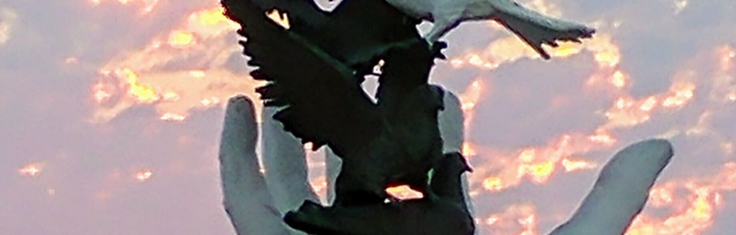 Statue in the middle of the beach overlooking the Aegean sea.