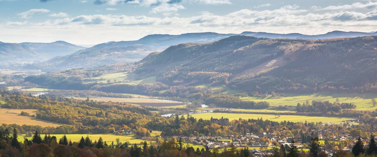 Tummel River meandering between hills near Pitlochry in Perthshire, Scotland on a sunny autumn day
