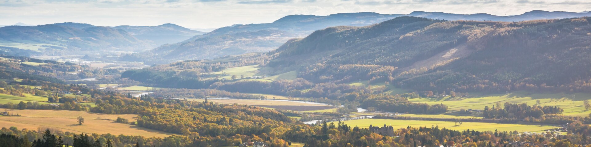 Tummel River meandering between hills near Pitlochry in Perthshire, Scotland on a sunny autumn day