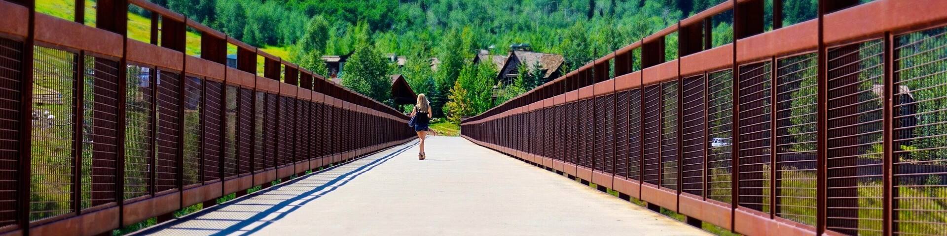Aspen Colorado in the summer is beautiful, with plenty of hiking and biking trails. Beginners can enjoy well kept, paved paths including this bridge over Maroon Creek near the Aspen Recreation Center. #takeahike #perspectives
