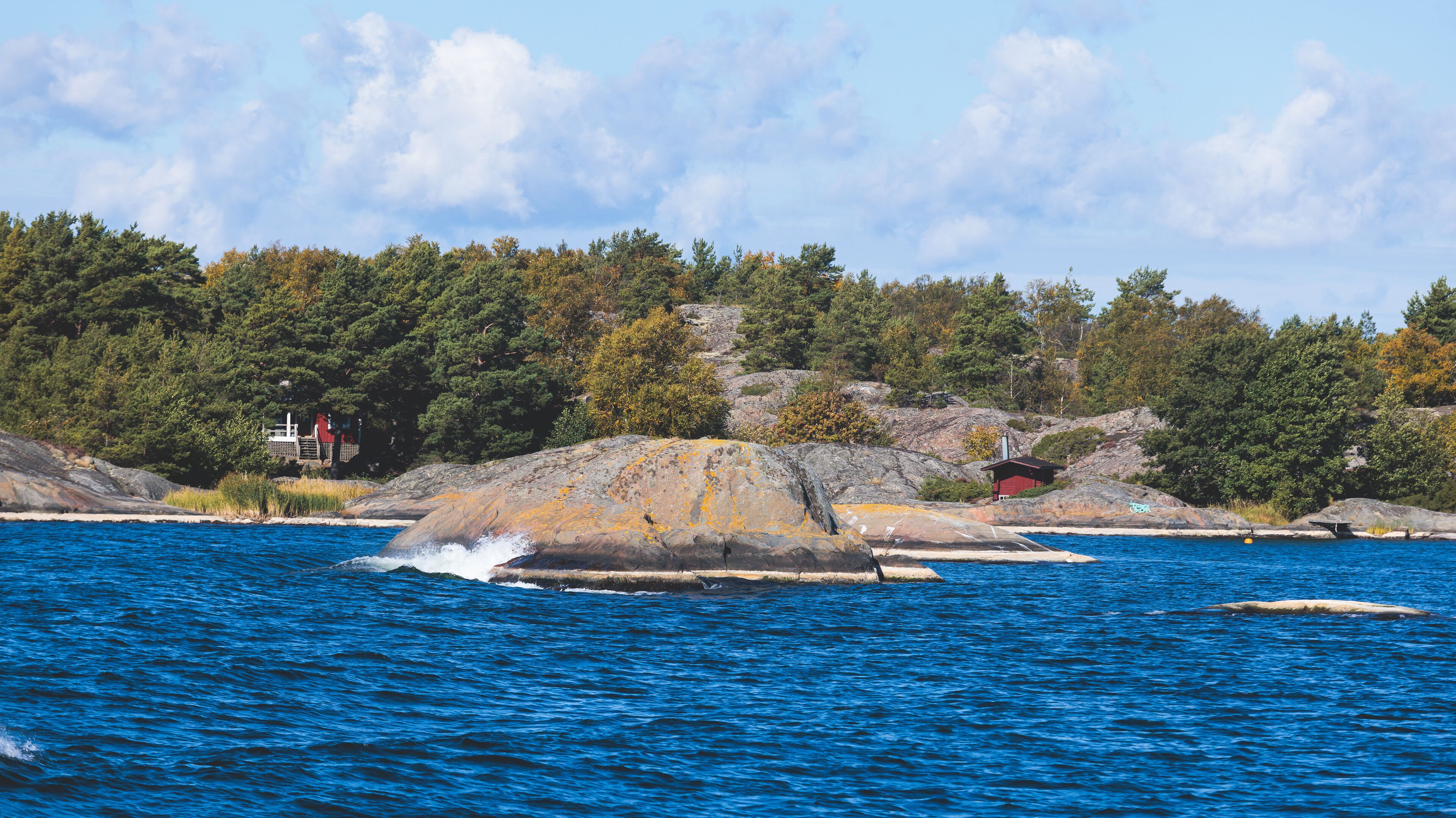 Archipelago National Park landscape, Southwest Finland, with islands, islets and skerries, Saaristomeren kansallispuisto, summer sunny day, view from shuttle ship ferry boat in the Archipelago Sea