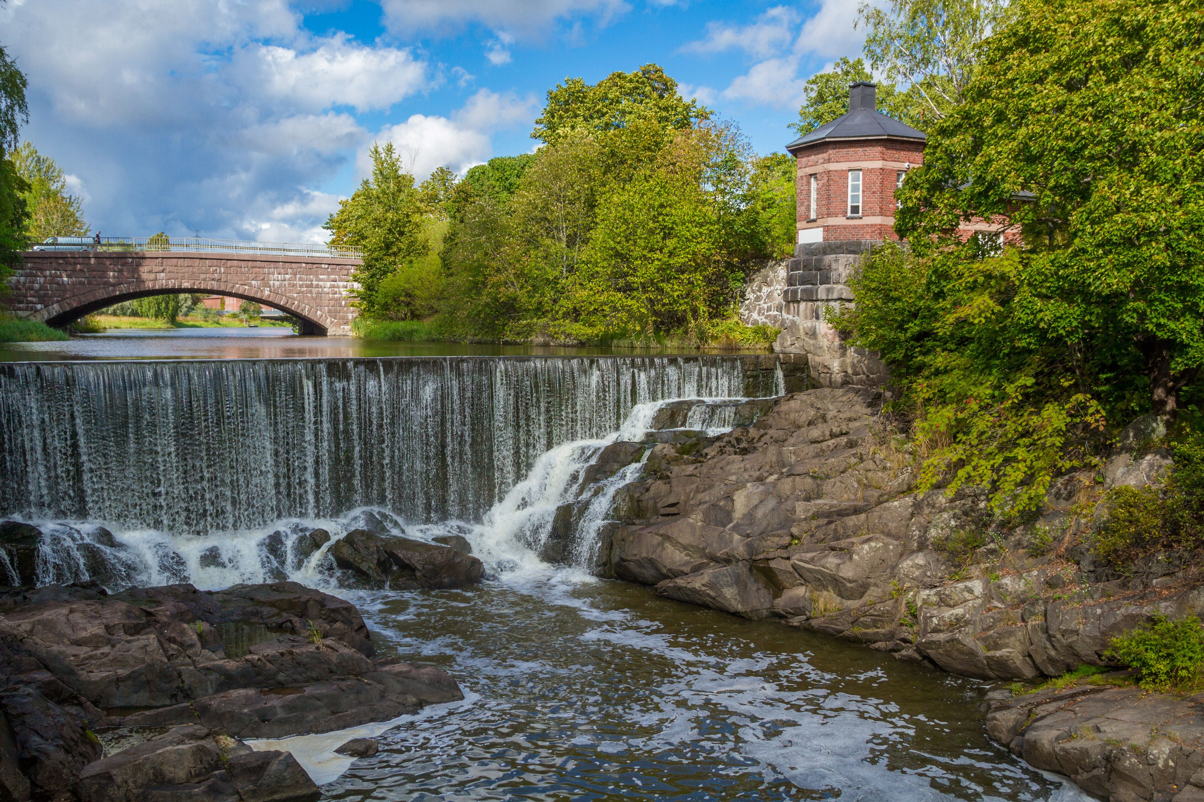 The picturesque view of Vanhakaupunki, the oldest part of Helsinki. The Vantaa river landscape, old hydroelectric power station