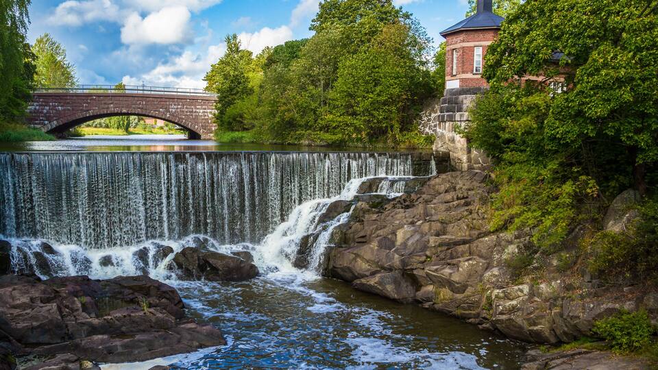 The picturesque view of Vanhakaupunki, the oldest part of Helsinki. The Vantaa river landscape, old hydroelectric power station
