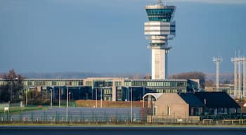 Brussels Airport control tower and skeyes buildings under blue sky