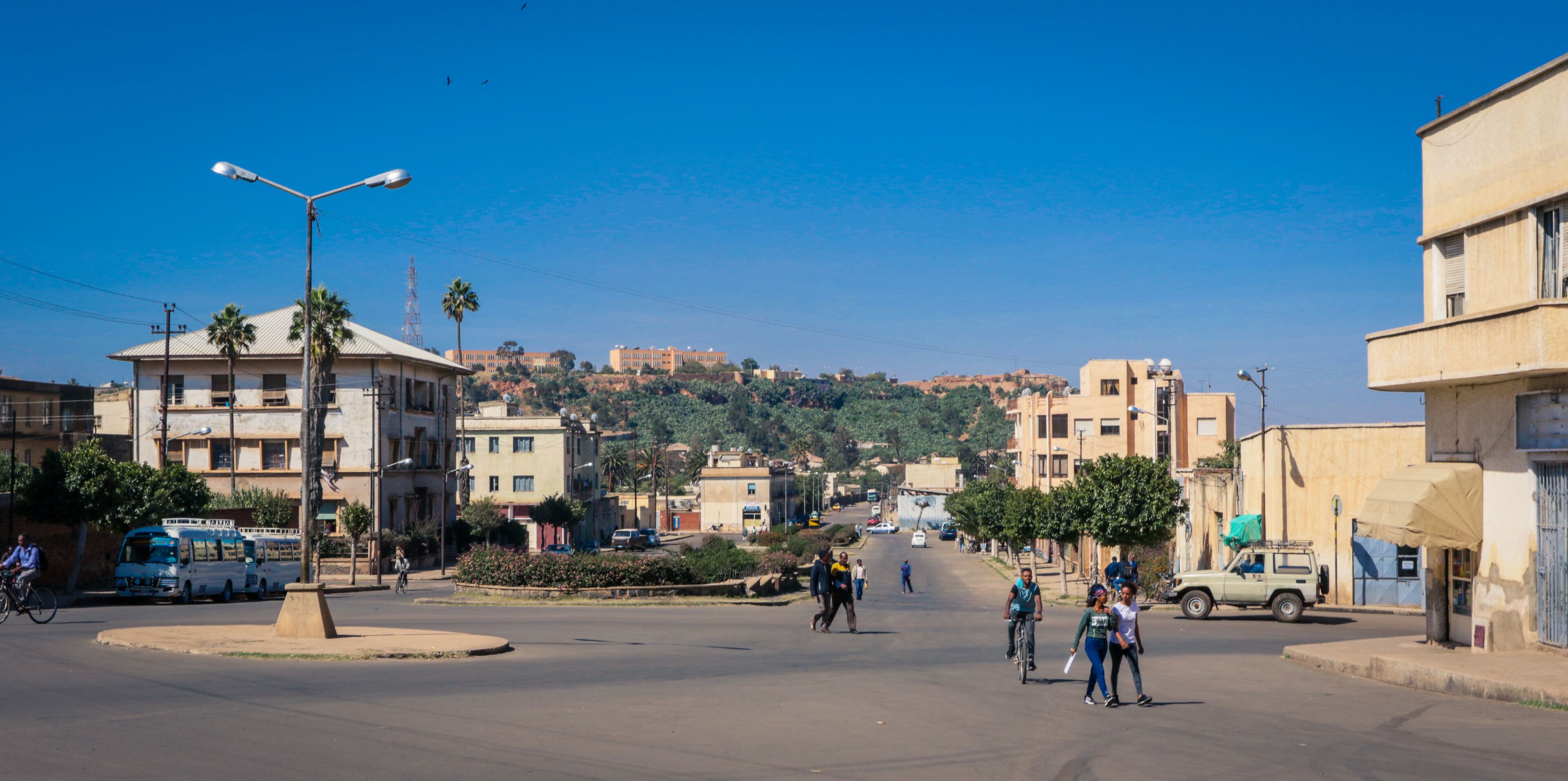 Asmara, Eritrea - November 01, 2019:  Old Buildings and Cars around of Local Market