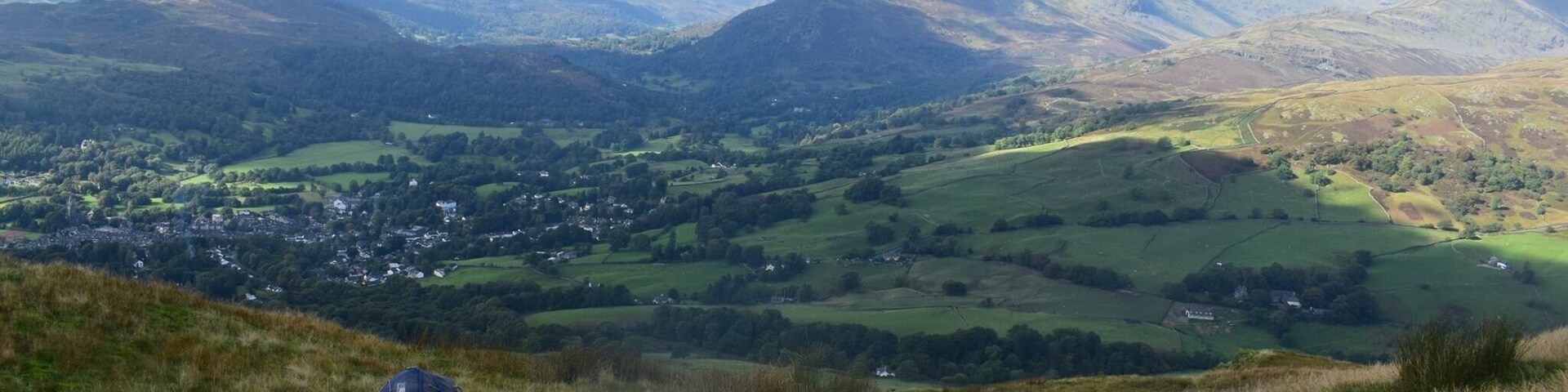 Climbing Wansfell Pike, but stopping to add to a cairn first!
