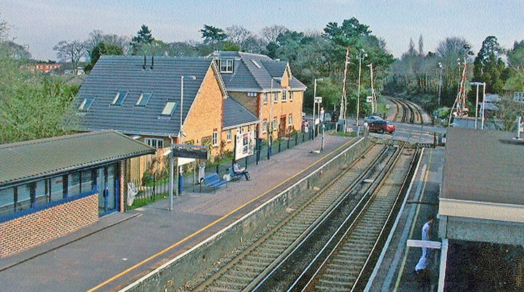 Sunningdale Station. View SE across A30 level-crossing, towards Virginia Water, Staines and London Waterloo: ex-LSWR London - Staines - Ascot - Reading line.