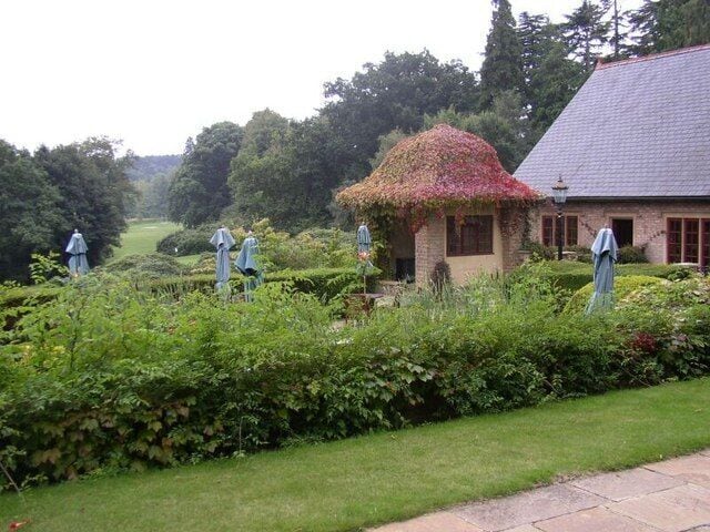 Pennyhill Park Hotel - Grounds Pennyhill Park hotel is a top class country hotel with 123 acres of grounds, between Camberley and Bagshot in Surrey. This photograph shows views from the hotel, with its gardens and then open parkland beyond. The building on the right of the picture is part of the hotel.