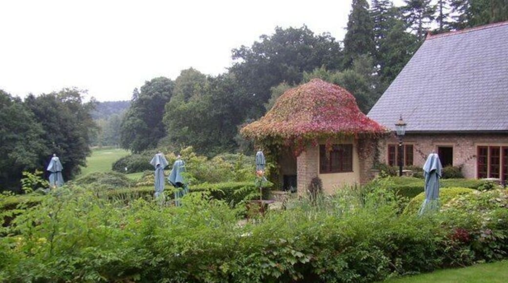 Pennyhill Park Hotel - Grounds Pennyhill Park hotel is a top class country hotel with 123 acres of grounds, between Camberley and Bagshot in Surrey. This photograph shows views from the hotel, with its gardens and then open parkland beyond. The building on the right of the picture is part of the hotel.