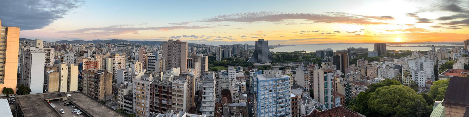 Aerial view of the central area of Porto Alegre with the Guaiba River in the background - sunset with clouds