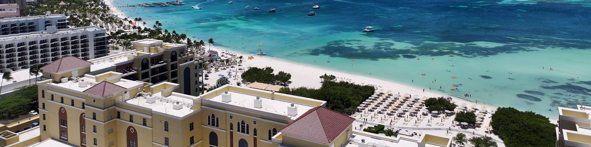 Palm Beach At Noord In Oranjestad Aruba. Beach Landscape. Caribbean Paradise. Noord At Oranjestad Aruba. Seascape Outdoor. Nature Tourism.
