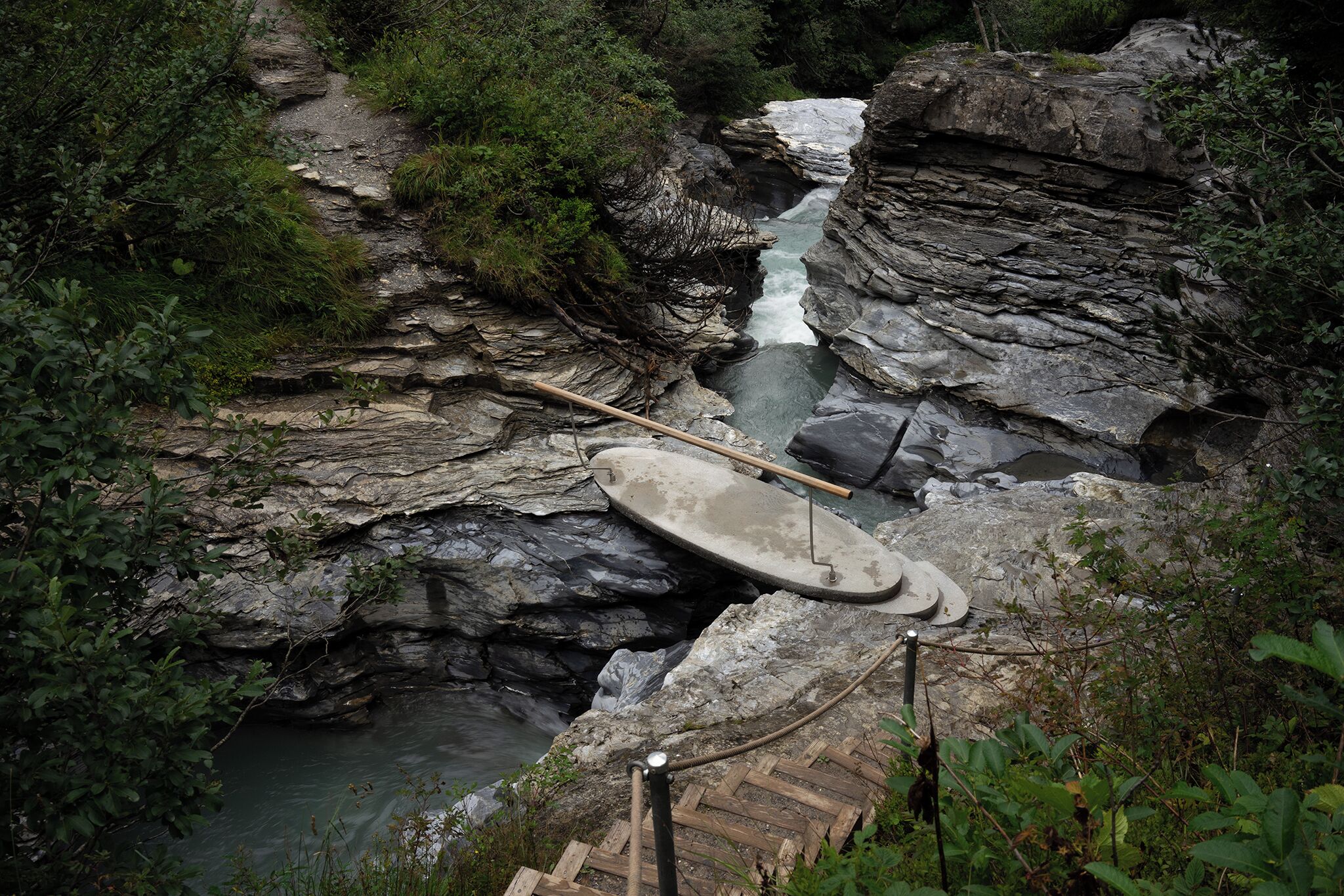 Crossing one of the seven bridges found along the 7-km-long mountain hiking trail “Trutg dil Flem' in Flims