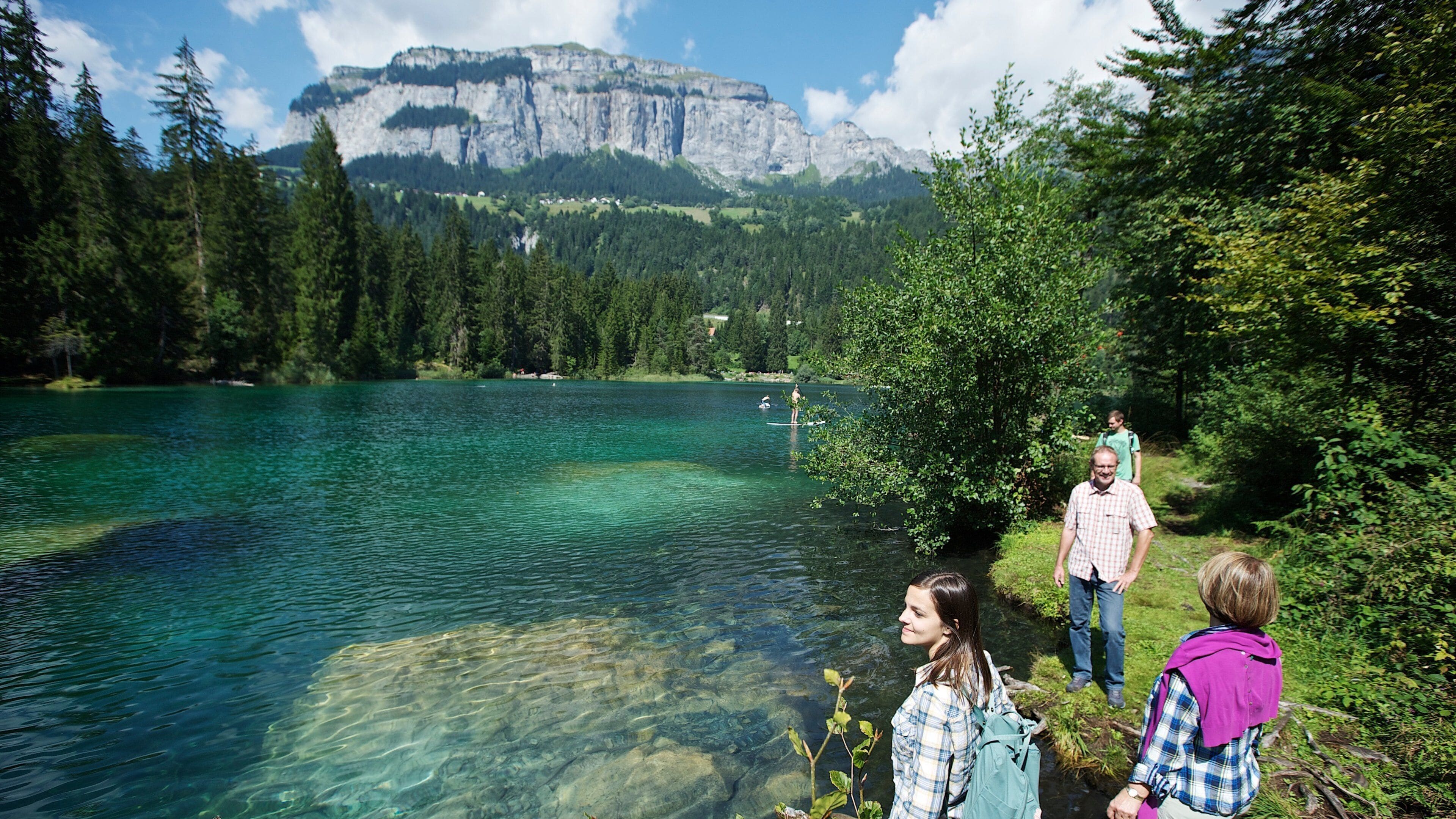 Flims which includes hiking or walking and a river or creek as well as a family